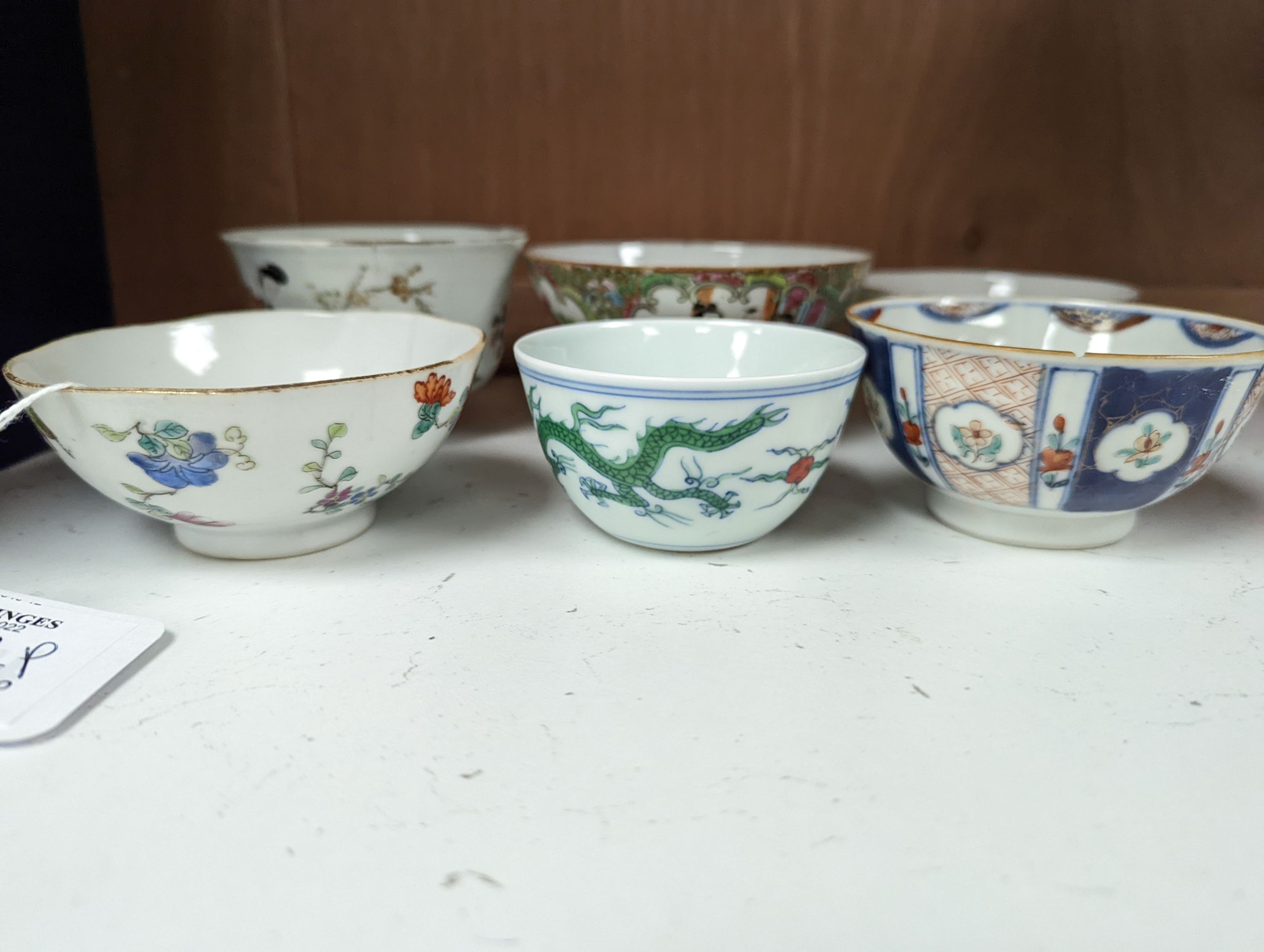 Nine Chinese porcelain tea bowls, tallest 6 cm.